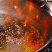 Pepper Crusted Steak Flambé