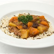 Lamb Stew With Dried Plums Served Over Wild Rice