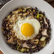 Mushroom and Zucchini Rice Topped With a Fried Egg