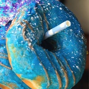 Blue Iced and Blueberry Custard-Filled Blueberry Roll Donut With Rock Candy