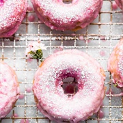 Rose Iced and Blueberry Custard-Filled Chocolate Round Donut With Coconut