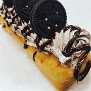 Chocolate-Filled Cinnamon Sugar Blueberry Long John With Crushed Oreos