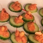 Cucumber Slices Topped With Sundried Tomato Hummus and Peanuts