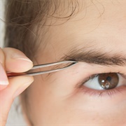Tweezing Stray Eyebrows