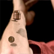 Catch a Coin on Your Elbow