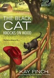 The Black Cat Knocks on Wood (Kay Finch)
