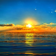 Watch the Sunset on the Pacific and Rise on the Alantic