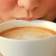 Taking a First Sip of Coffee in the Morning