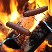 Hot Dogs Over a Campfire