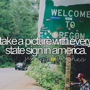 Take a Picture With Every State Sign in America