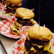 The Cow Calf-Hay: 6 Half Lb Burger Patties, Cheese, Onion Rings, Fries, Cake