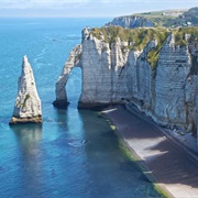 Visit the Enormous Chalk Cliffs of Etretat, Normandy.