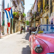 Watch Classic Cars Cruise Past in Viñales, Cuba.