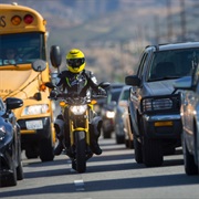 Motorcyclists Cutting Ahead in Traffic Jams