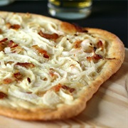 Have Tarte Flambée in Alsace.