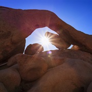 Stand in Arch Rock in Joshua Tree