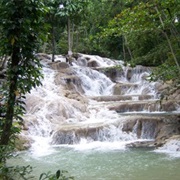 Wading Through the Dunns River Falls in Jamaica