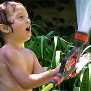 Playing Under the Garden Hose