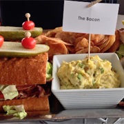 Machine Room Grille: 4 1 Lb Bacon Sandwiches, Potato Salad, and Chips