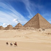 See the Great Pyramids of Giza (Only Ancient Wonder Still in Existence)