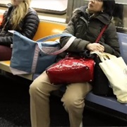 Using Seats to Hold Their Bags