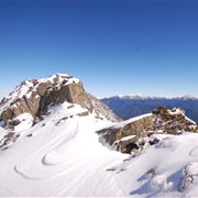 See Snow-Covered Mountains