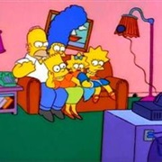 Bart Lies Across Family's Lap