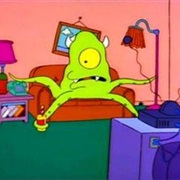 Space Alien Escapes Through Trap Door