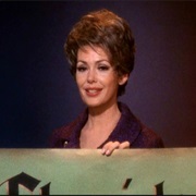 Nora Clavicle (Barbara Rush)