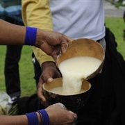 Try Chicha or "Spit Beer" in Peru