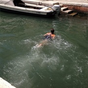Swim Across a Canal in Venice