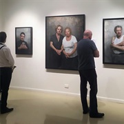 Exhibit Paintings in Art Gallery
