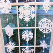 Cut Out Paper Snowflakes and Hang in the Windows
