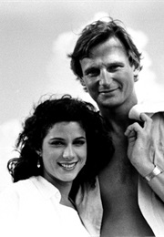 Liam Neeson and Saundra Santiago in Miami Vice (1984)
