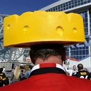 Mocked Wisconsinites Who Wear Cheese-Wedge Hats