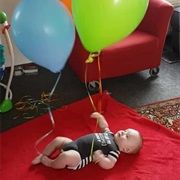 Binding Balloons at the Wrists Keeps Baby Busy