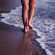 Walking on a Warm Sandy Beach in the Evening