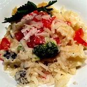 Mafaldine Pasta With Tomatoes, Broccoli, Olives and Parmesan Cheese