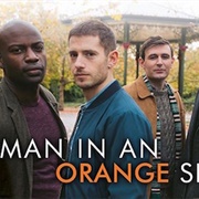 Man in an Orange Shirt