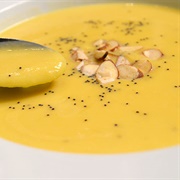 Creamy Pumpkin Soup With Slivered Nuts and Tiny Black Seeds