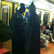 Darth Vader and Batman Subway Bound