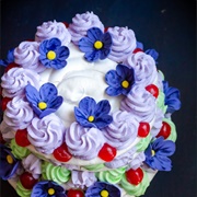 Pudding With Whipped Cream and Sugared Violets