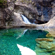 See the Fairy Pools in Scotland