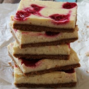 Eggnog Cranberry Swirl Cheesecake Bars