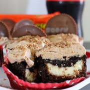 Cheesecake Filled Coca-Cola Cupcakes With Reese's Cup Frosting