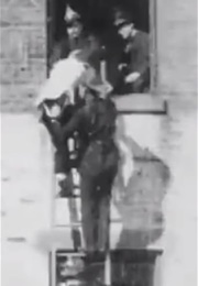 Firemen Rescuing Men and Women (1899)