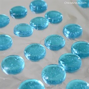 Brightly-Colored Hard Candy in Flat Round Disks