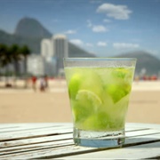 Drinking a Caipirinha Cocktail on Copacabana Beach, Rio De Janeiro