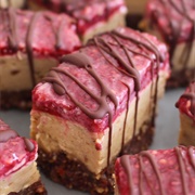 Peanut Butter and Raspberry Jam Cheesecake Slice