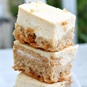 Golden Oreo-Stuffed Snickerdoodle Blondie Cheesecake Bars